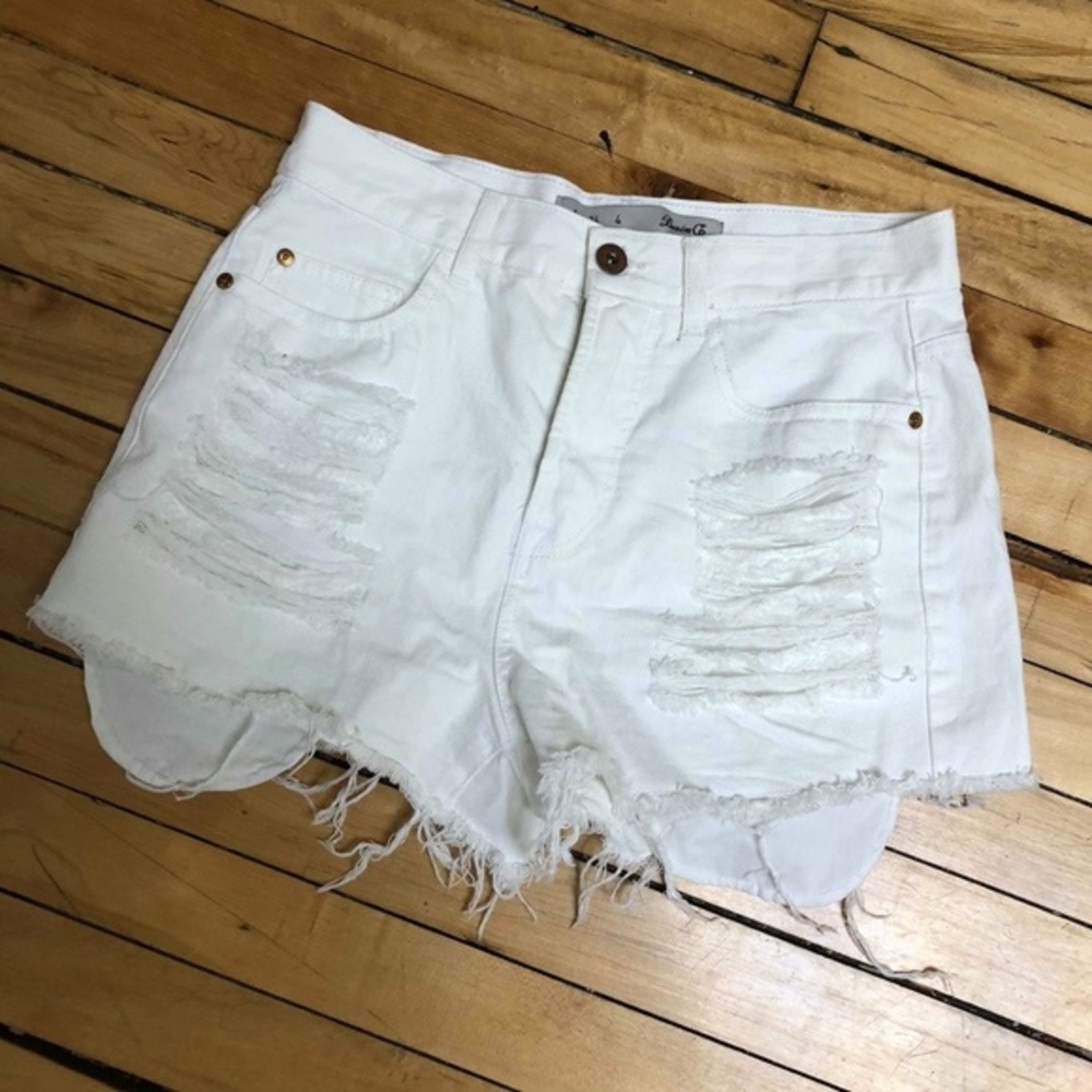 High waisted white distressed denim shorts